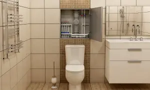 Łazienka z widocznymi rurami CO w otwartej szafce nad toaletą, umywalką i grzejnikiem.